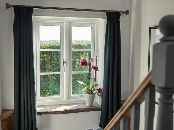 View of a white window from a staircase